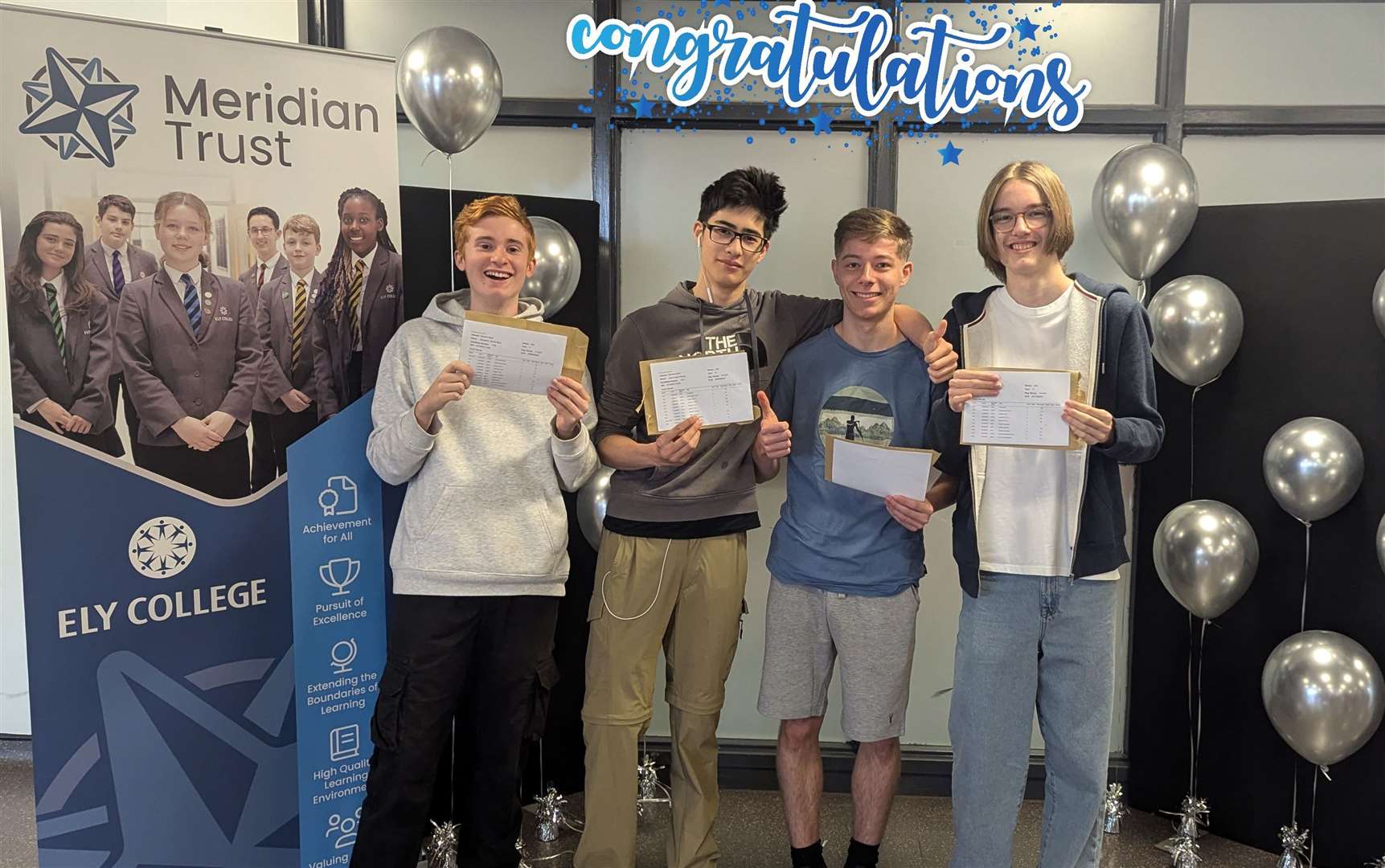Students at Ely College pose with their results